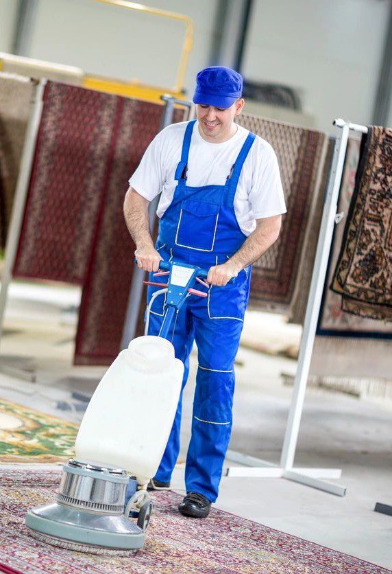 Man cleaning a carpet