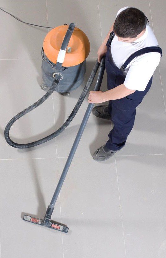 man using a vacuum cleaner